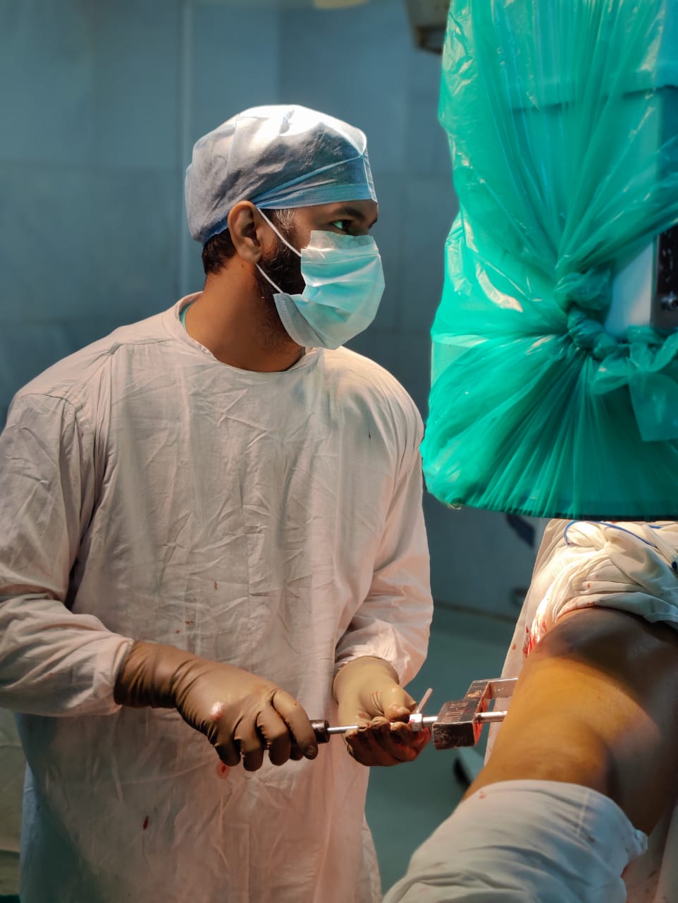 Dr. Sunil performing orthopedic surgery in the operating theatre